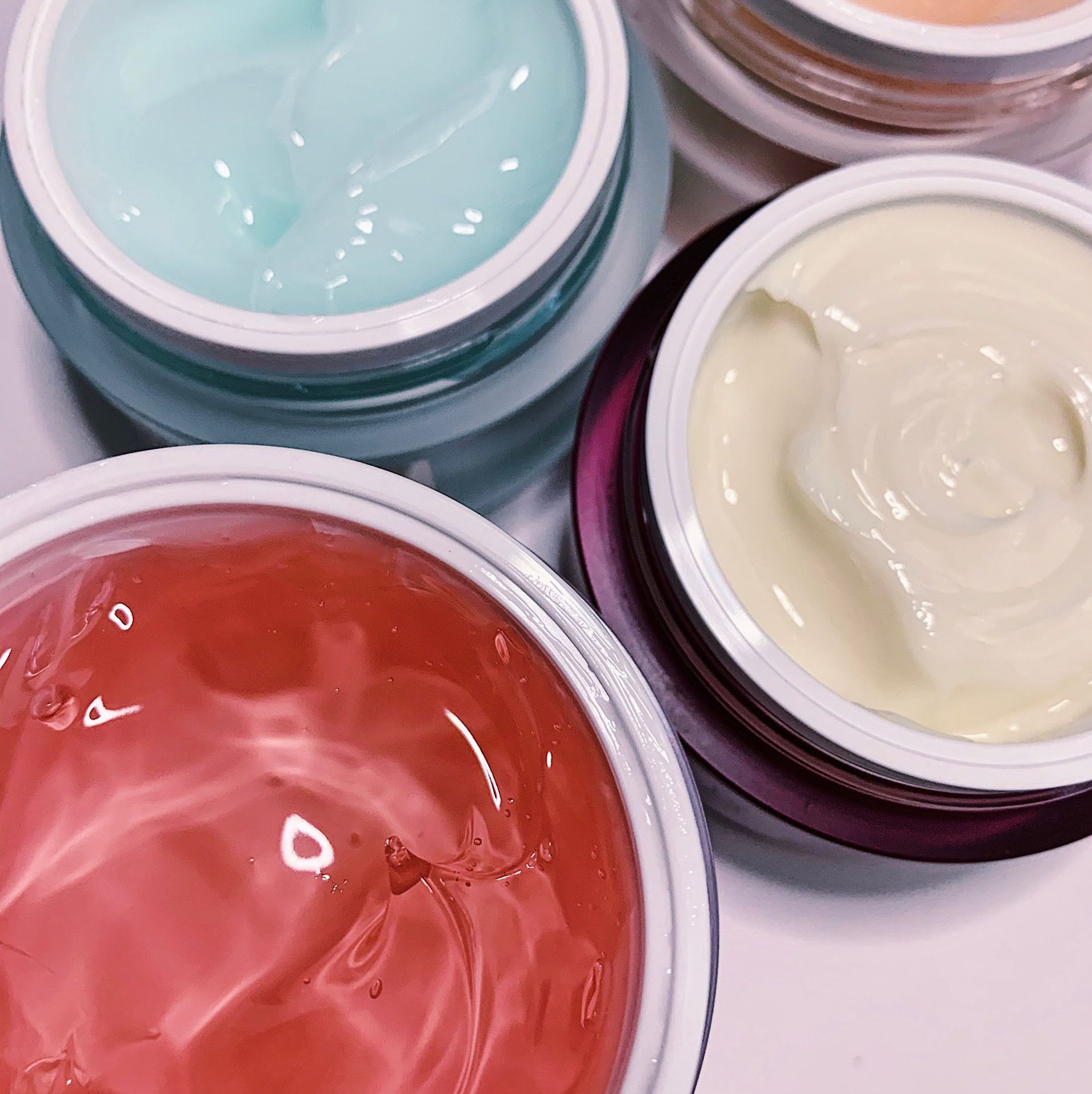 A photo of four moisturizers from Thank You Farmer. A mix of gel moisturizers, creams, and lotion textures.