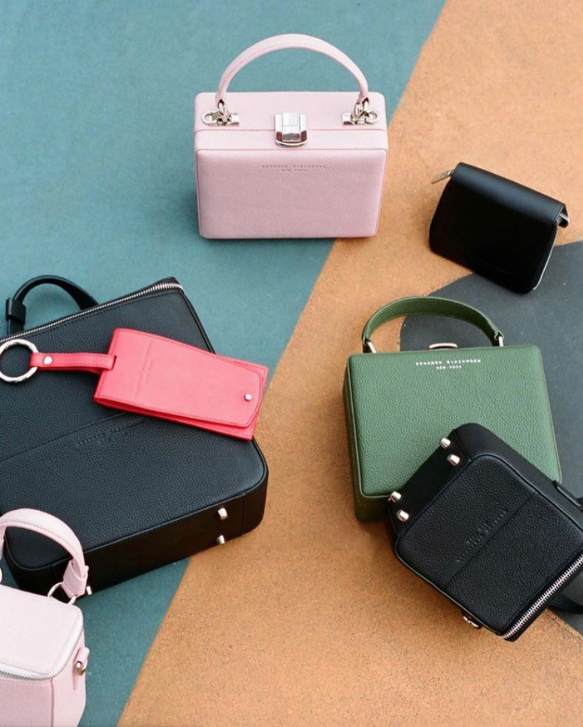 Photo of handbags, wallets, and small accessories from Brandon Blackwood New York, a Black-Owned handbag line. 