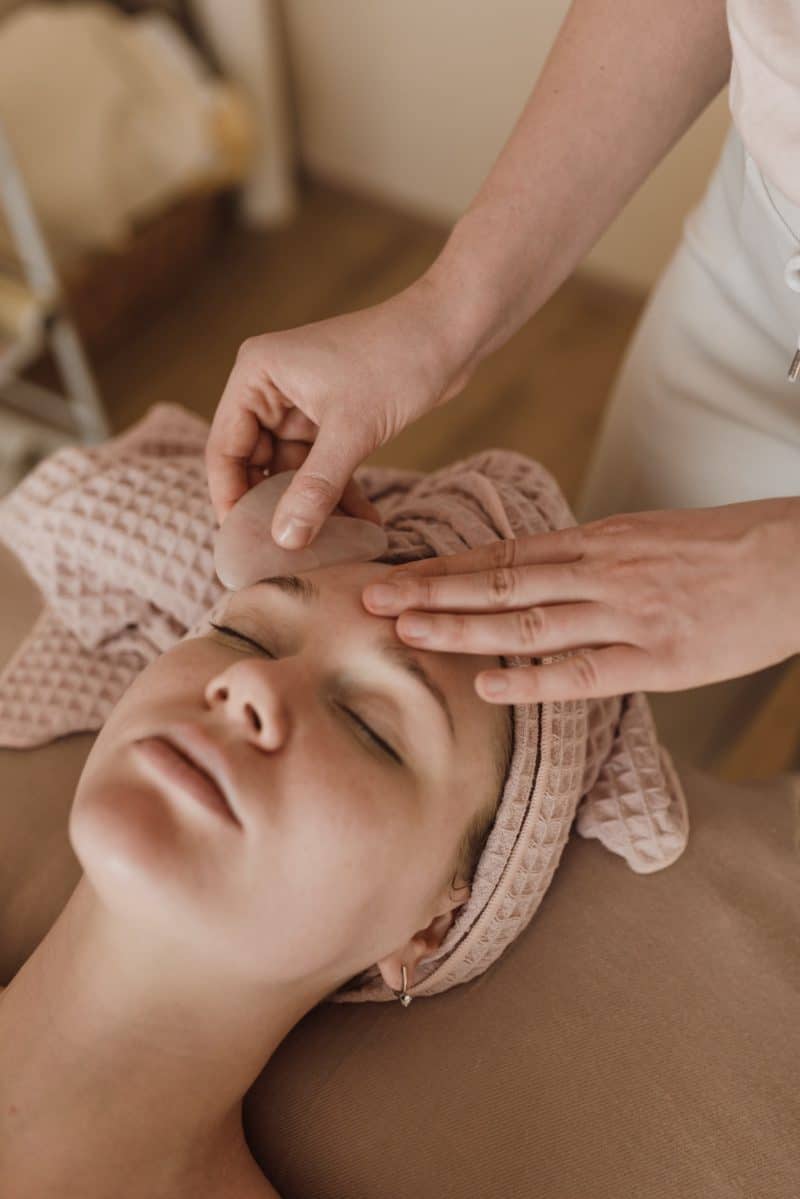Photo of an esthetician giving a facial massage
